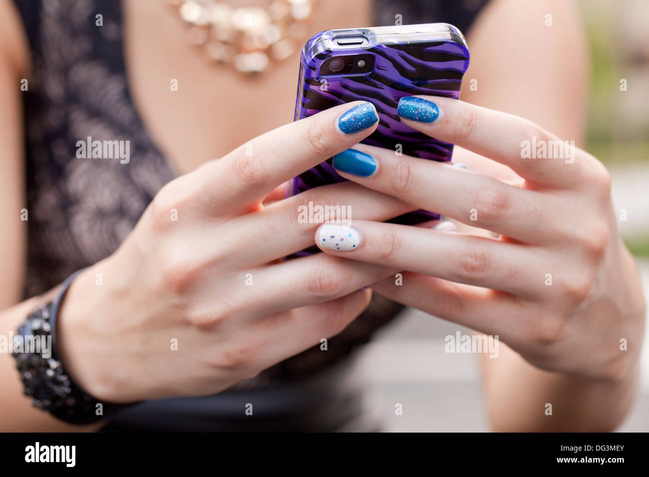 Closeup of woman's hands using smart phone - USA Stock Photo
