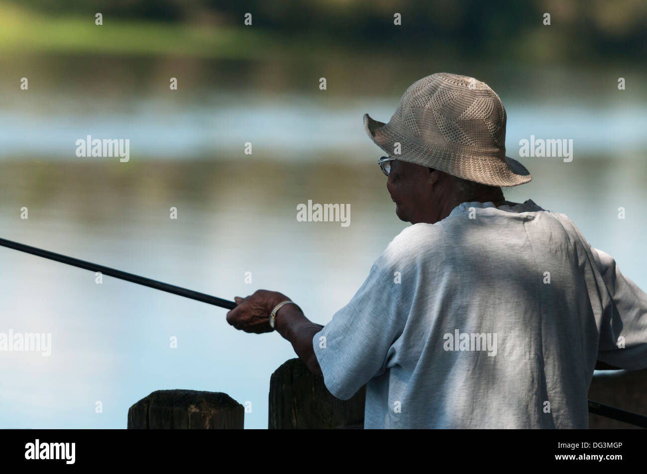 Portrait woman fishing pole on hi-res stock photography and images