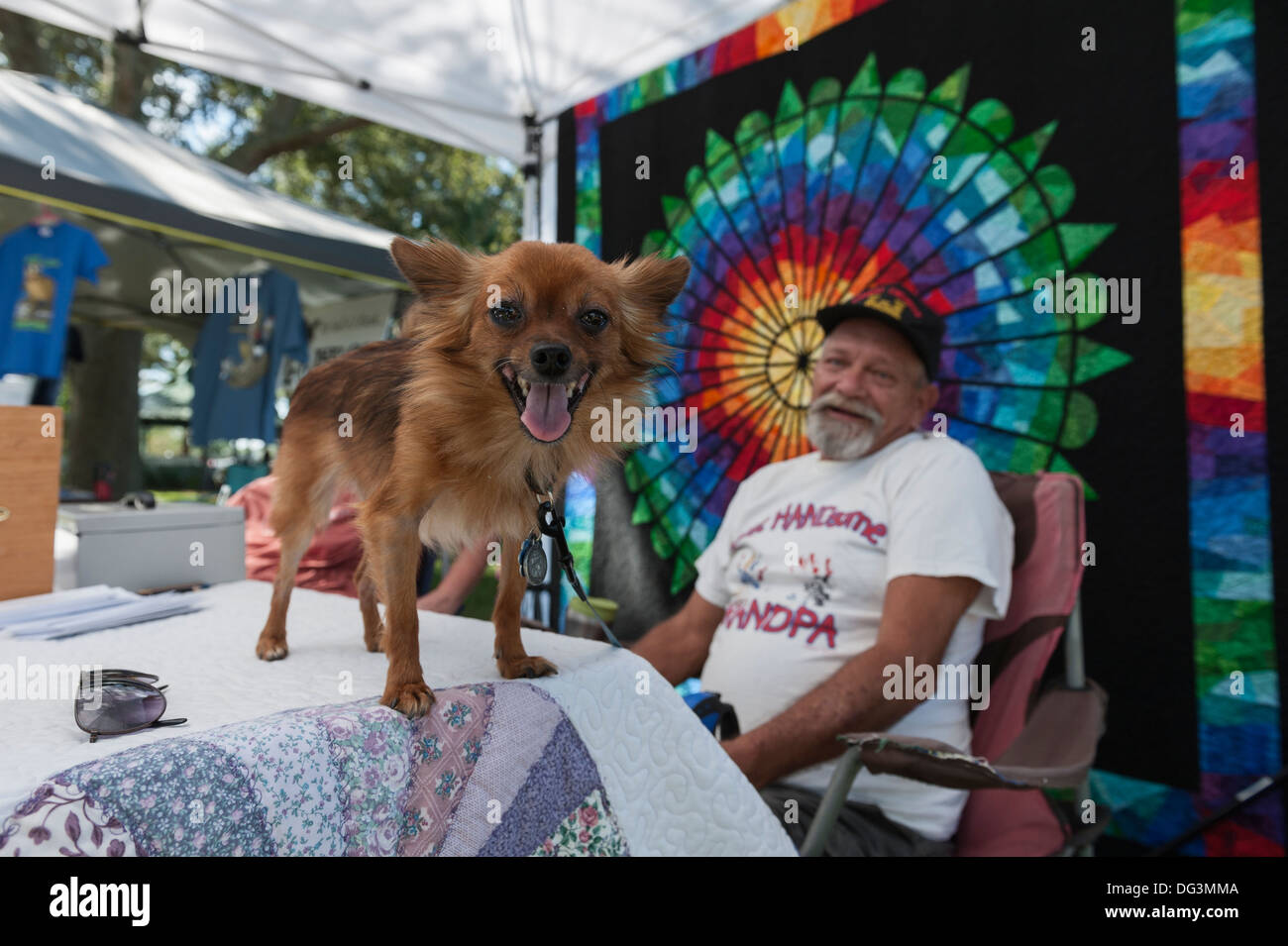 A man at the Eustis, Florida Folk Art Festival showing his pet. Stock Photo