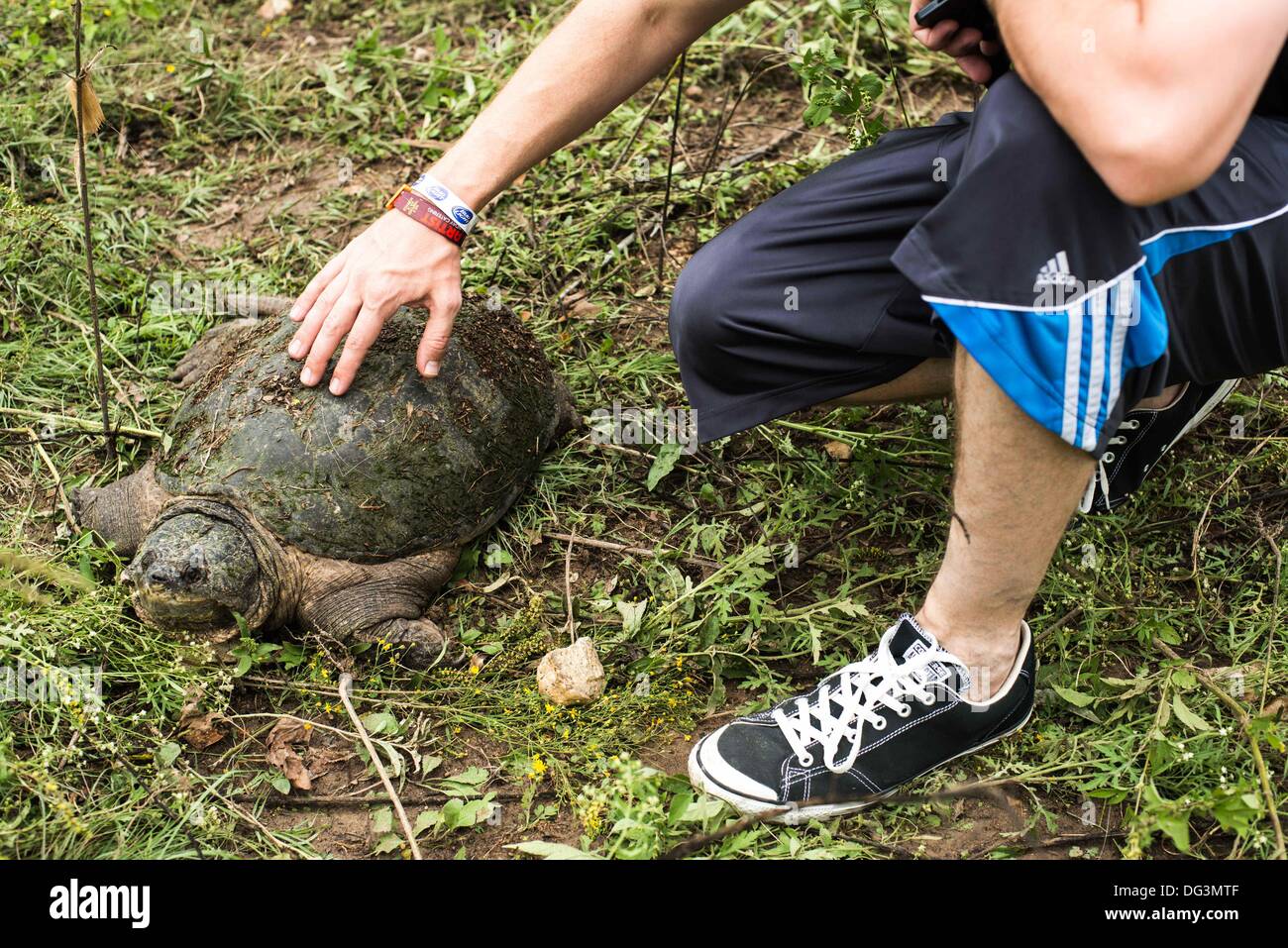Austin, TX, USA. 13th Oct, 2013. An ACL Festival fan sits with a ...