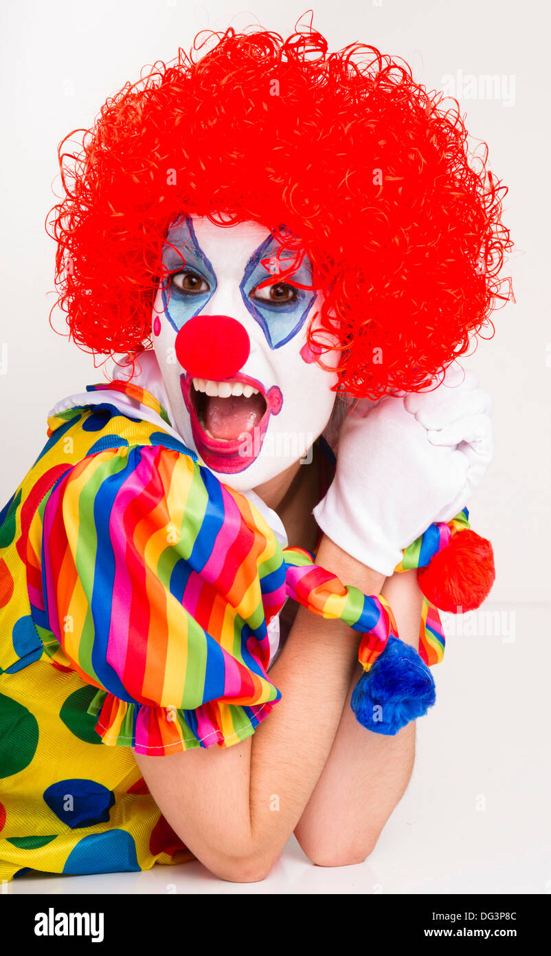 Colorful female clown actress speaking out Stock Photo