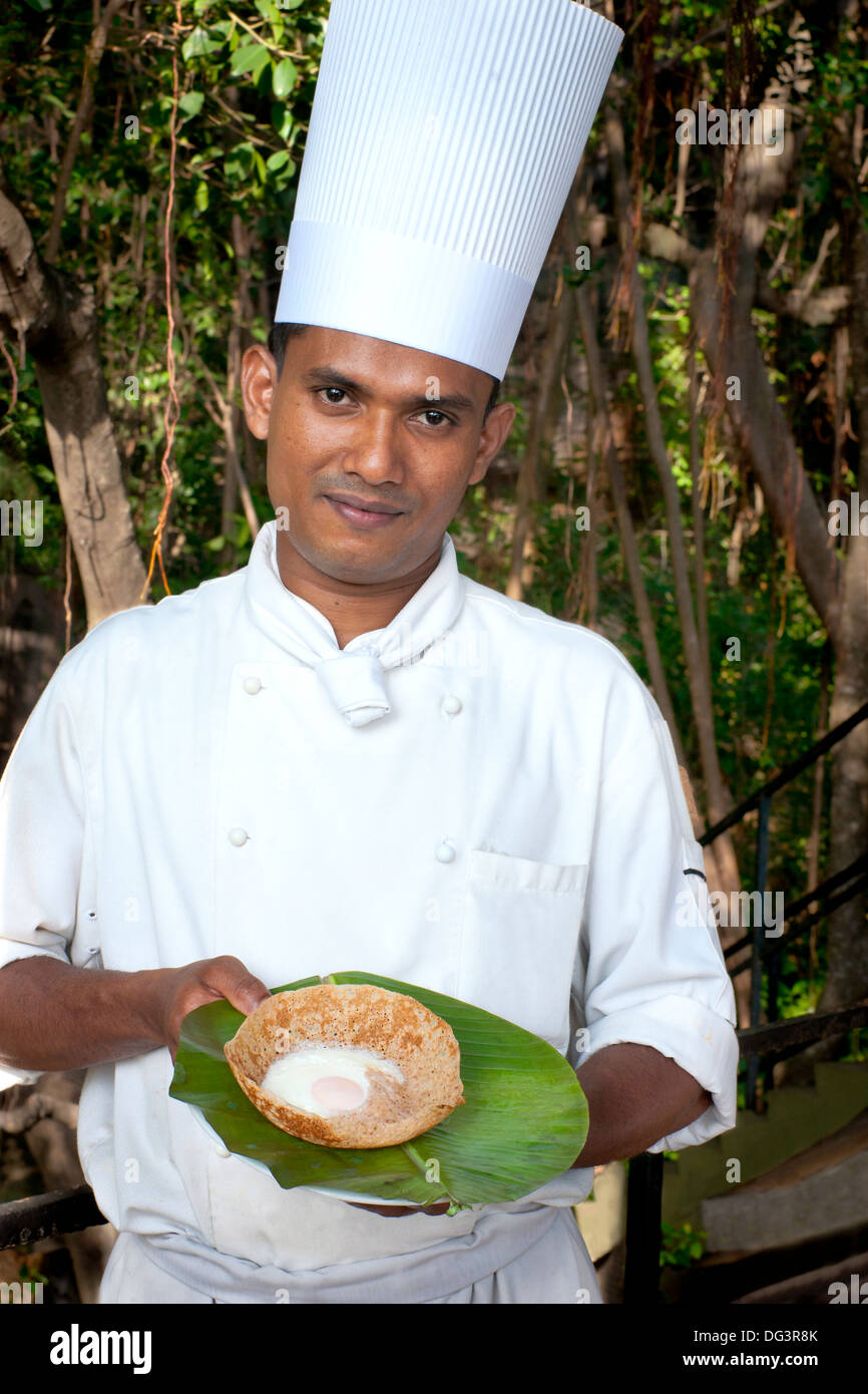 chef with a traditional breakfast egg hopper, Dambulla, Sri Lanka