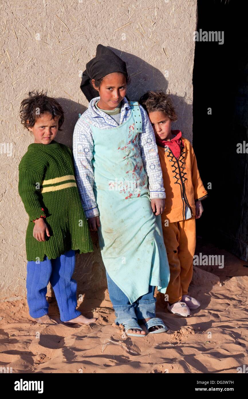 Morocco Sahara Desert near Erfoud Erg Chebbi Black Desert Village with local children Stock Photo