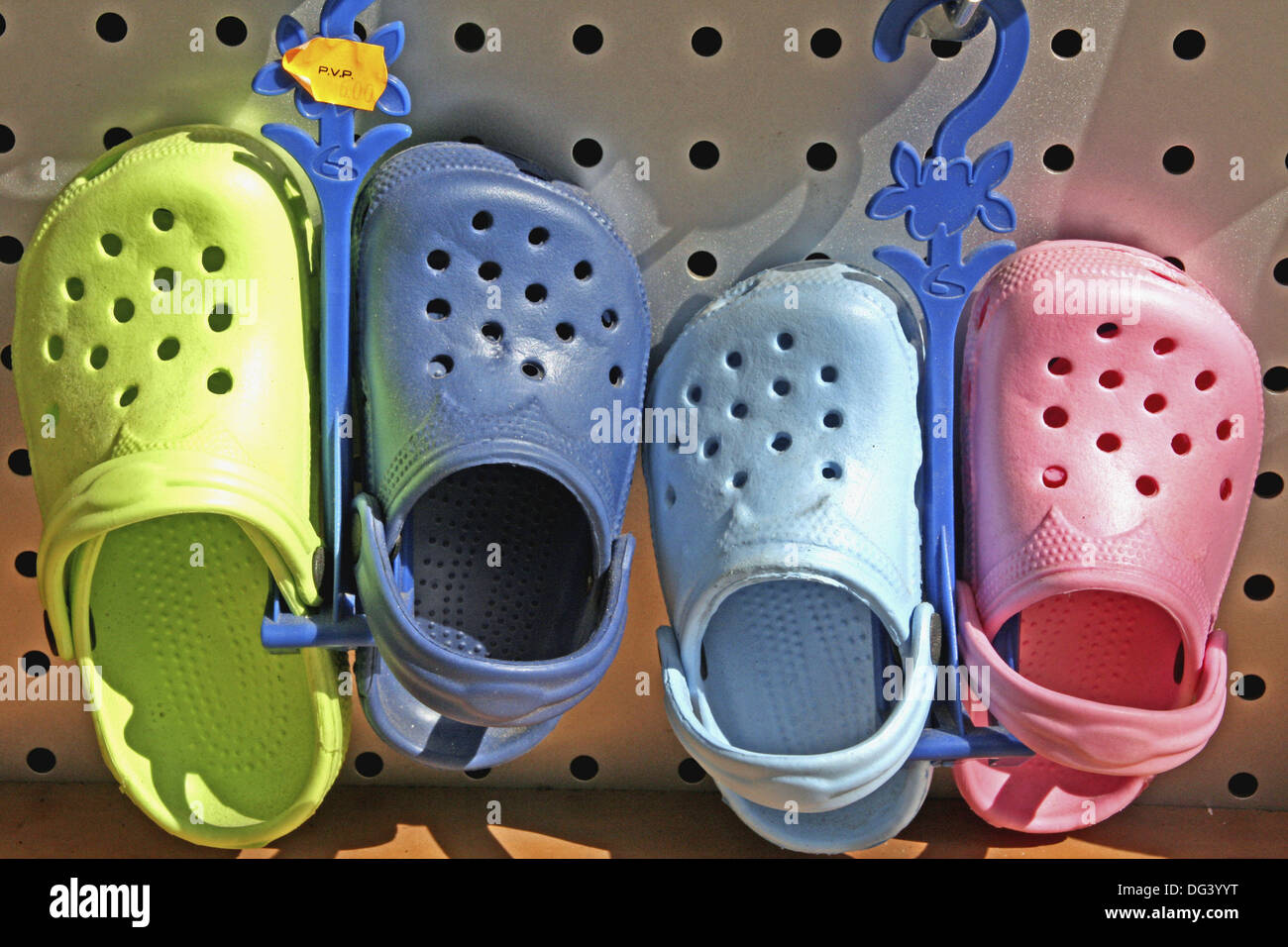 Green, blue and pink crocs Stock Photo - Alamy