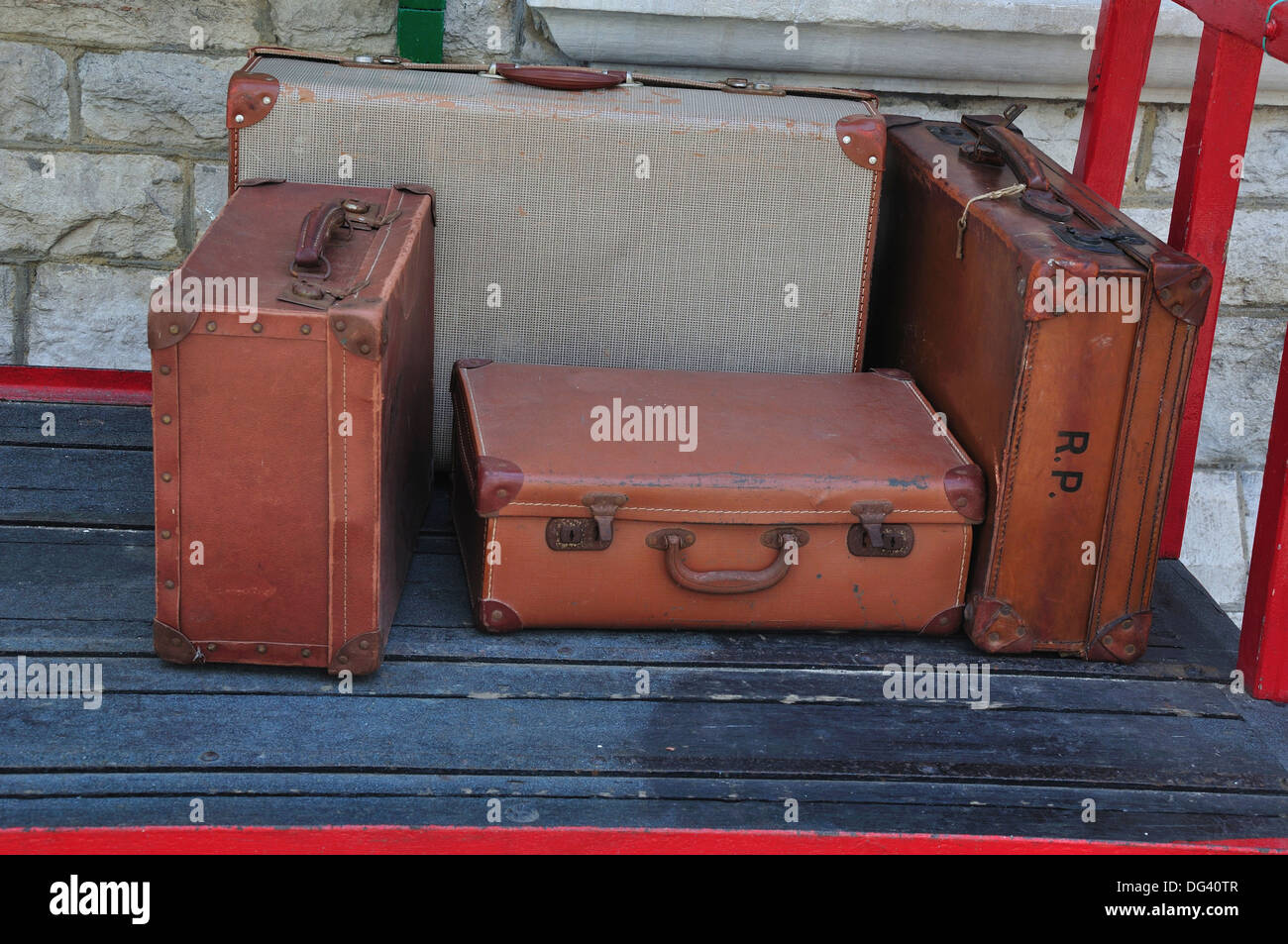 Old suitcases on a railway trolley UK Stock Photo