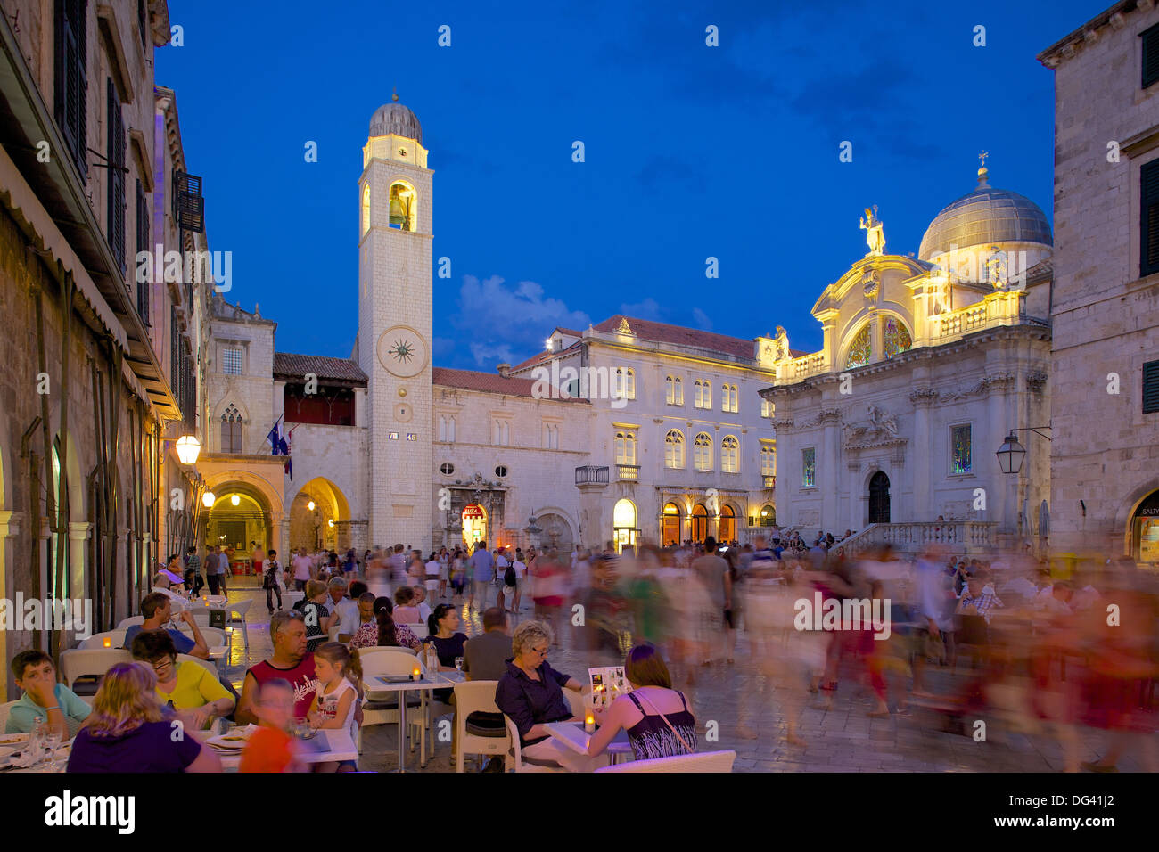 Clock tower and restaurants at dusk, Stradun, UNESCO World Heritage Site, Dubrovnik, Dalmatian Coast, Dalmatia, Croatia, Europe Stock Photo