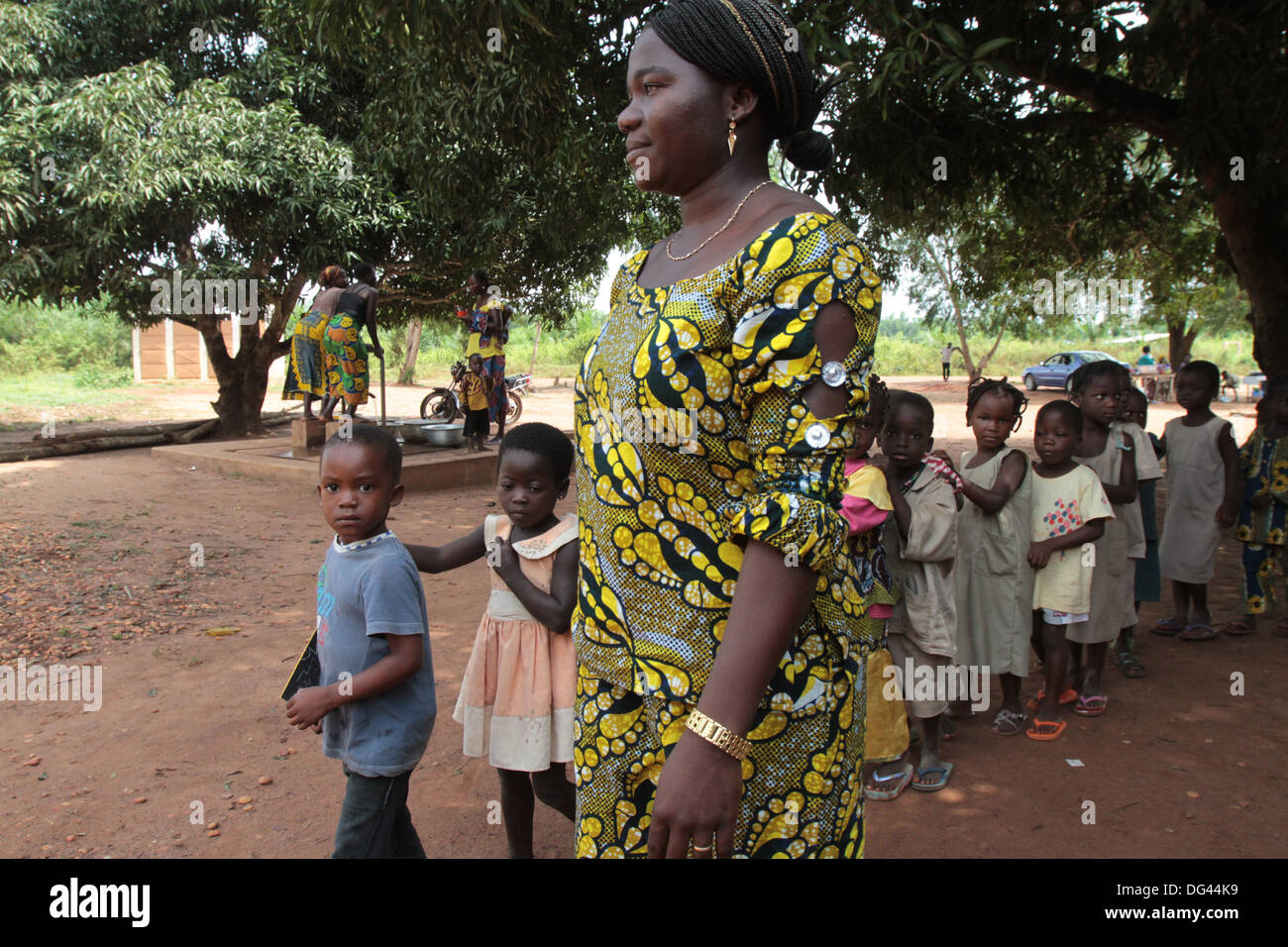Teacher accompanying students to school, Hevie, Benin, West Africa, Africa Stock Photo