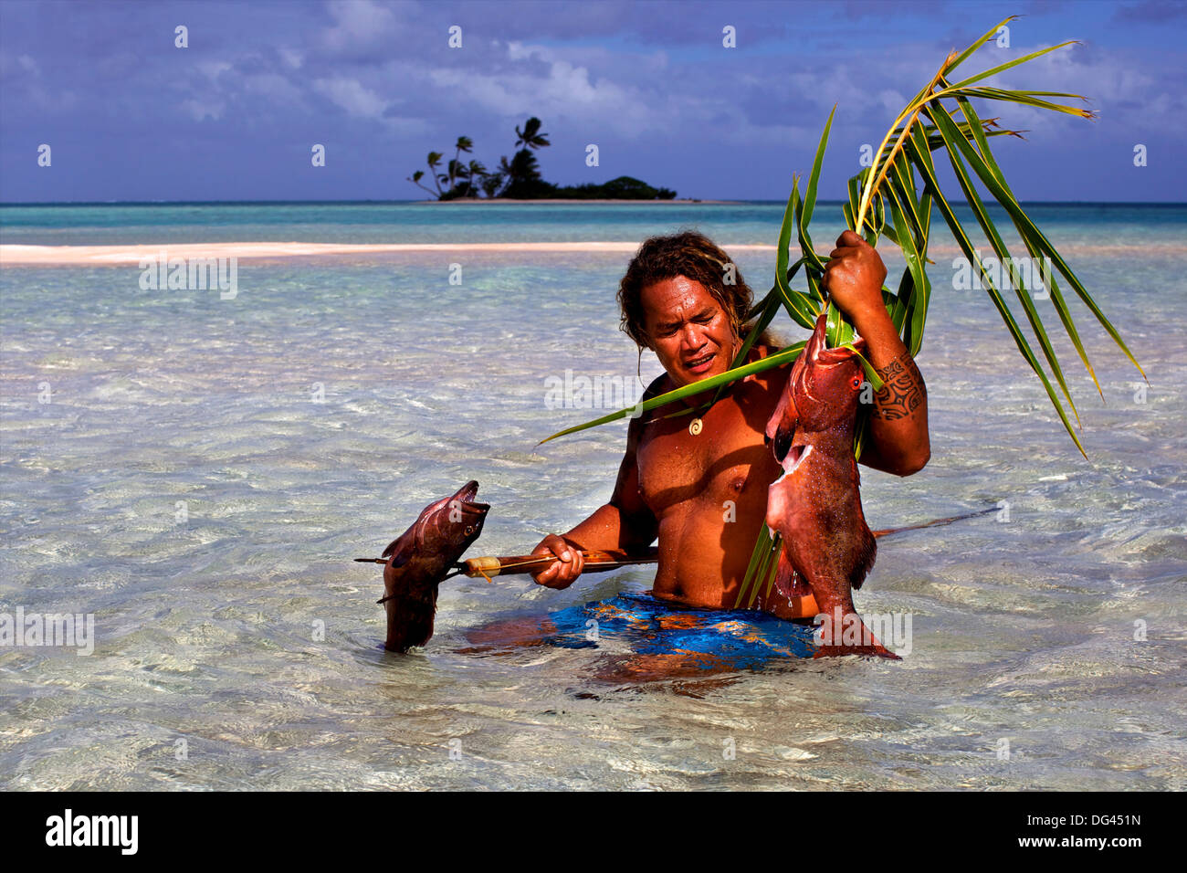 Fishing with a harpoon, at the White Sands, Tetamanu Pass, Fakarava Island, Tuamotu archipelago, French Polynesia Stock Photo
