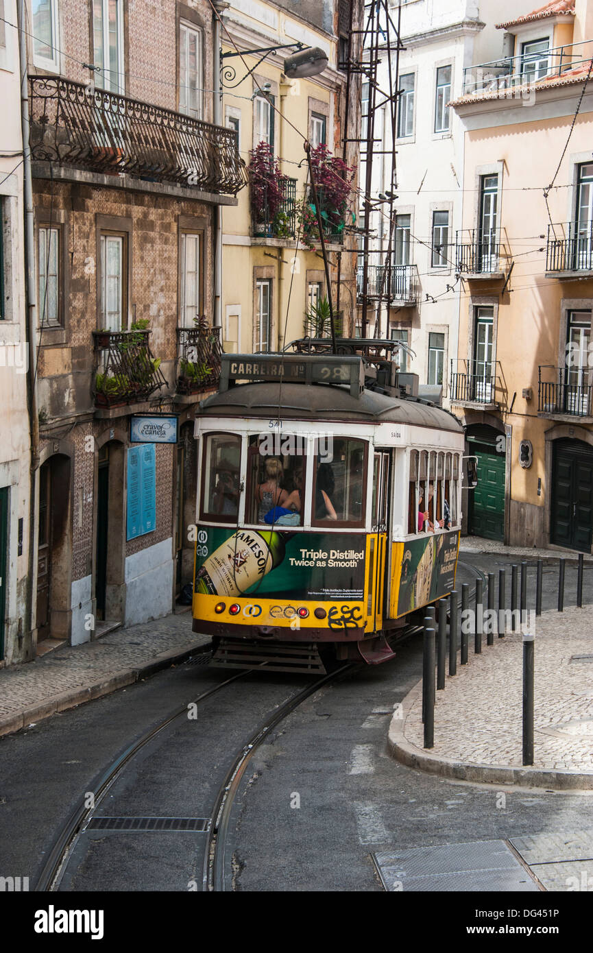 Famous tram 28 going through the old quarter of Bario Alto, Lisbon