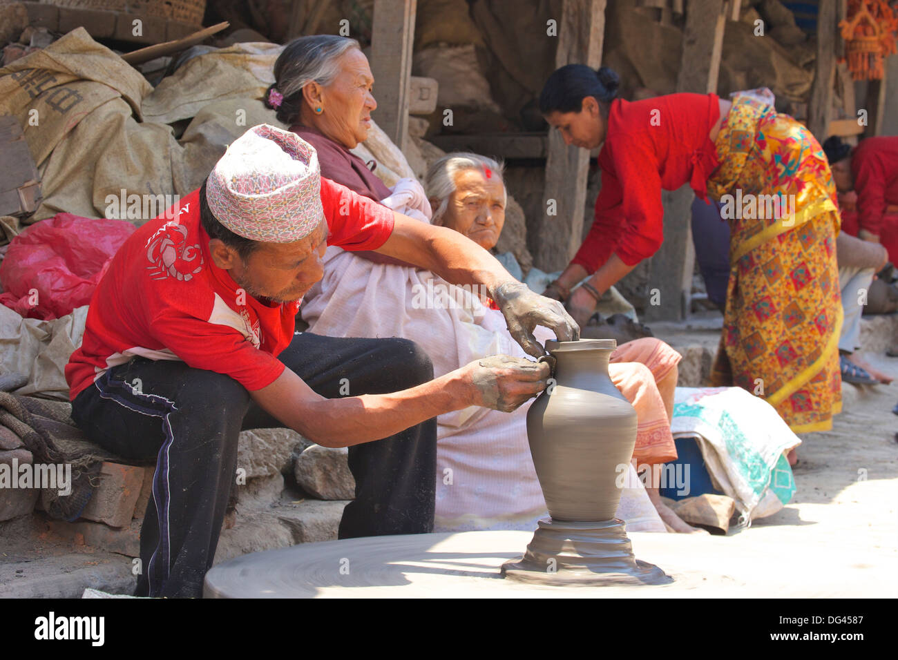 Potter turning pot on wheel, Potter's Square, Bhaktapur, Nepal, Asia Stock Photo