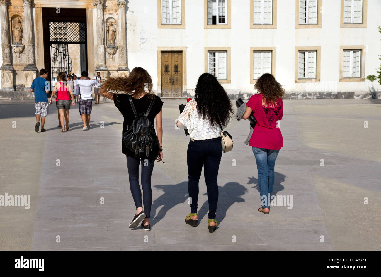 Entrance gate ( Porta Ferrea) and students in Courtyard of the old University of Coimbra, Coimbra, Portugal Stock Photo