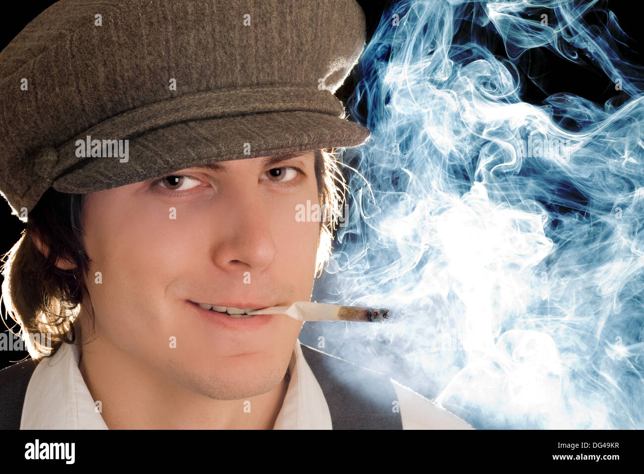 Portrait of smoking man with sly smile. Isolated on black Stock Photo