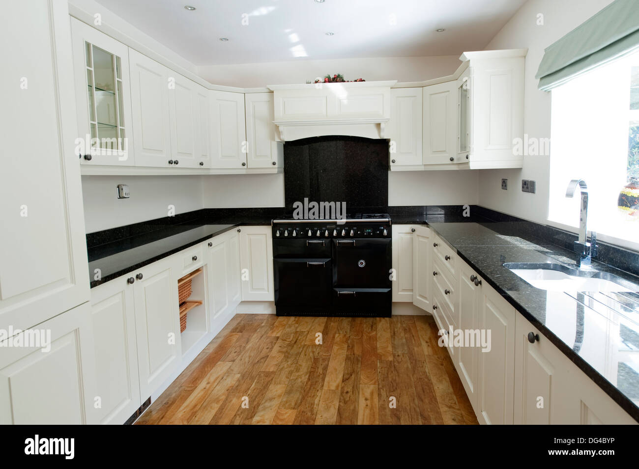 Modern white and Black Kitchen in large house Stock Photo