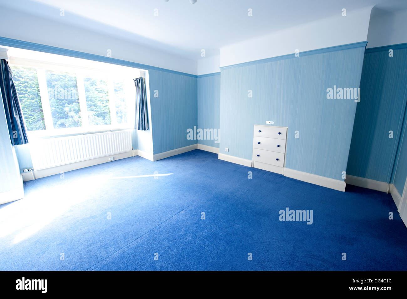 Empty blue bedroom sell sold house buy buying move out in Stock Photo