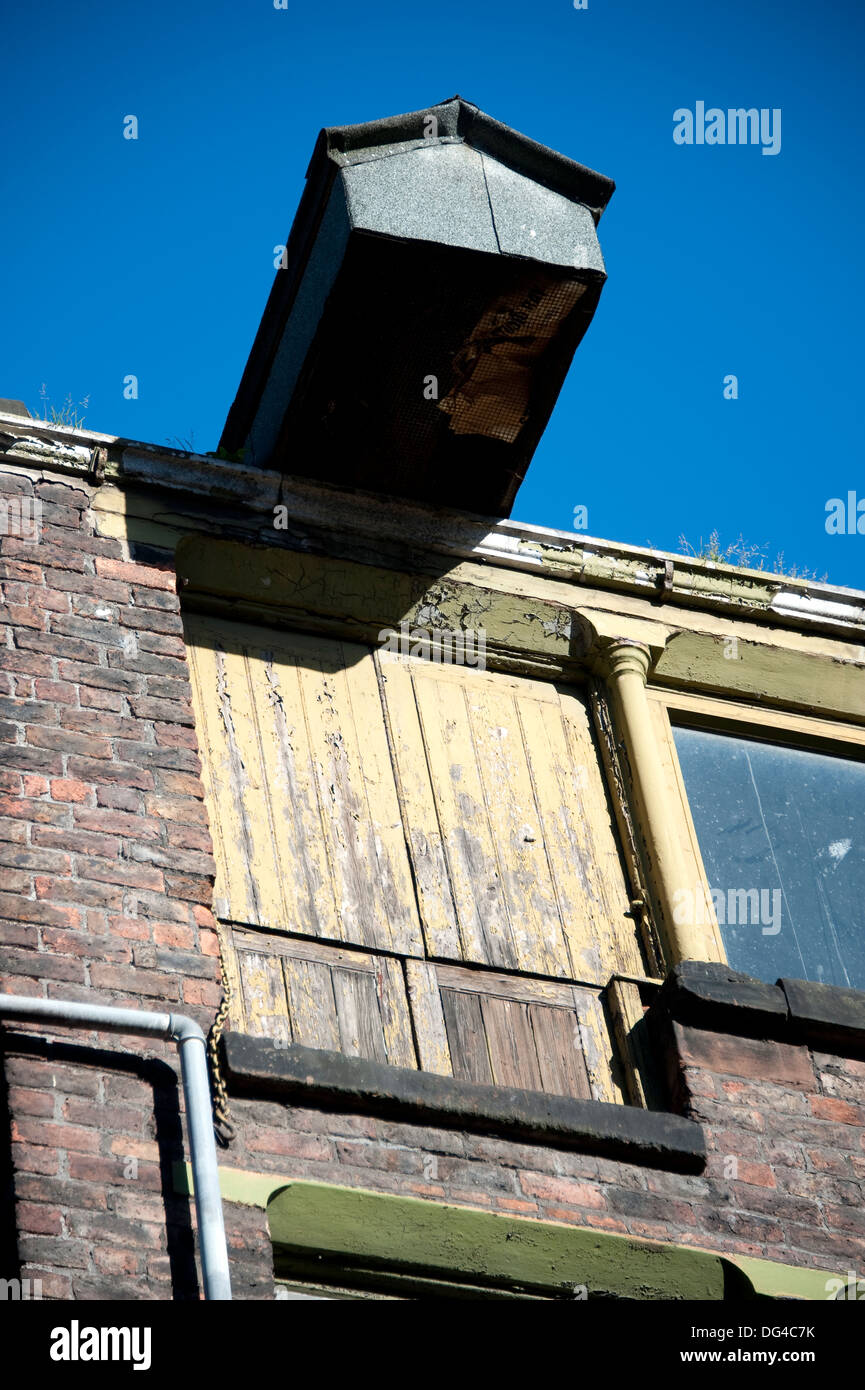Old weathered grain hoist door mill milling Stock Photo