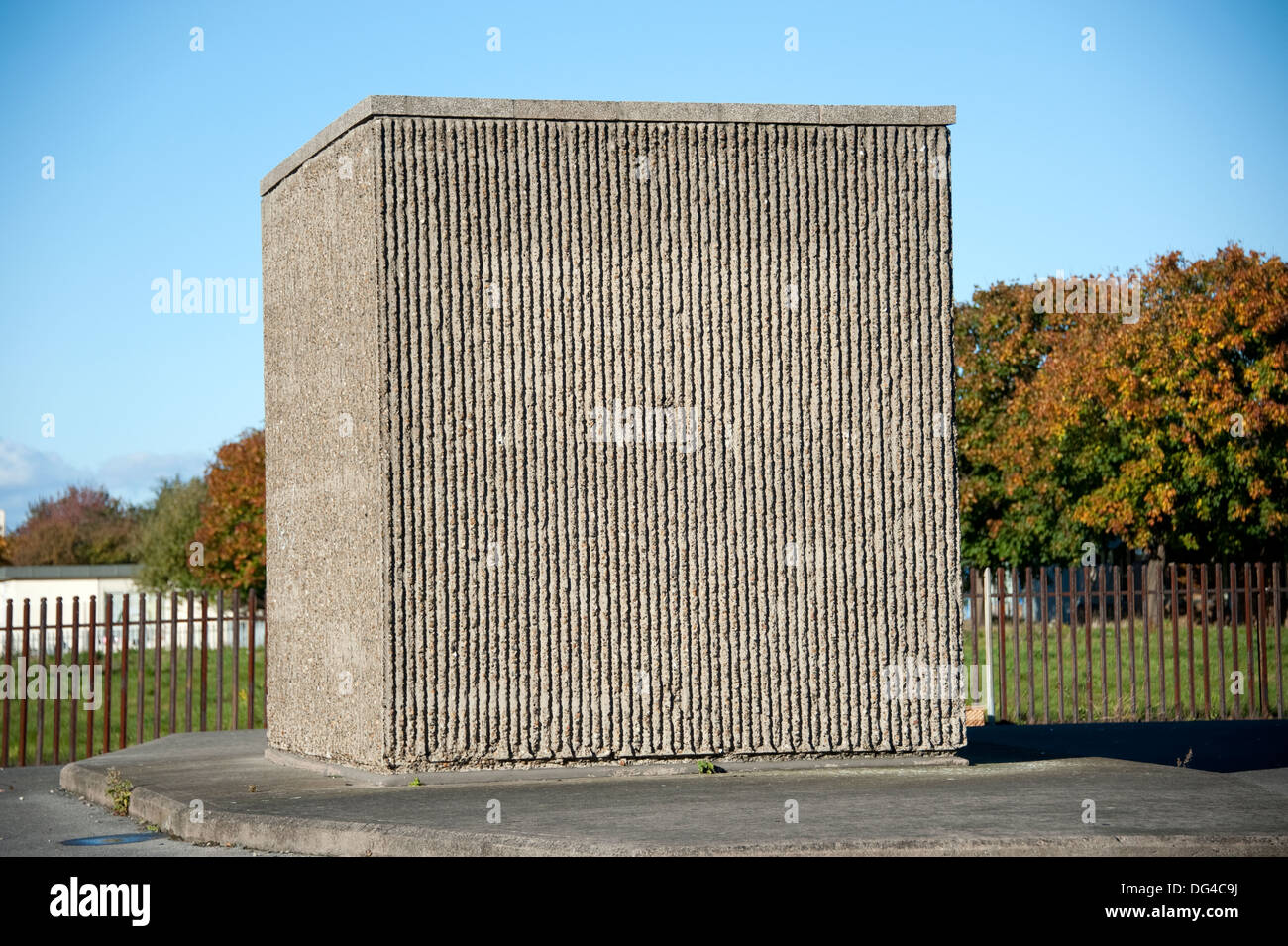 Square concrete block cube huge alien odd bold Stock Photo