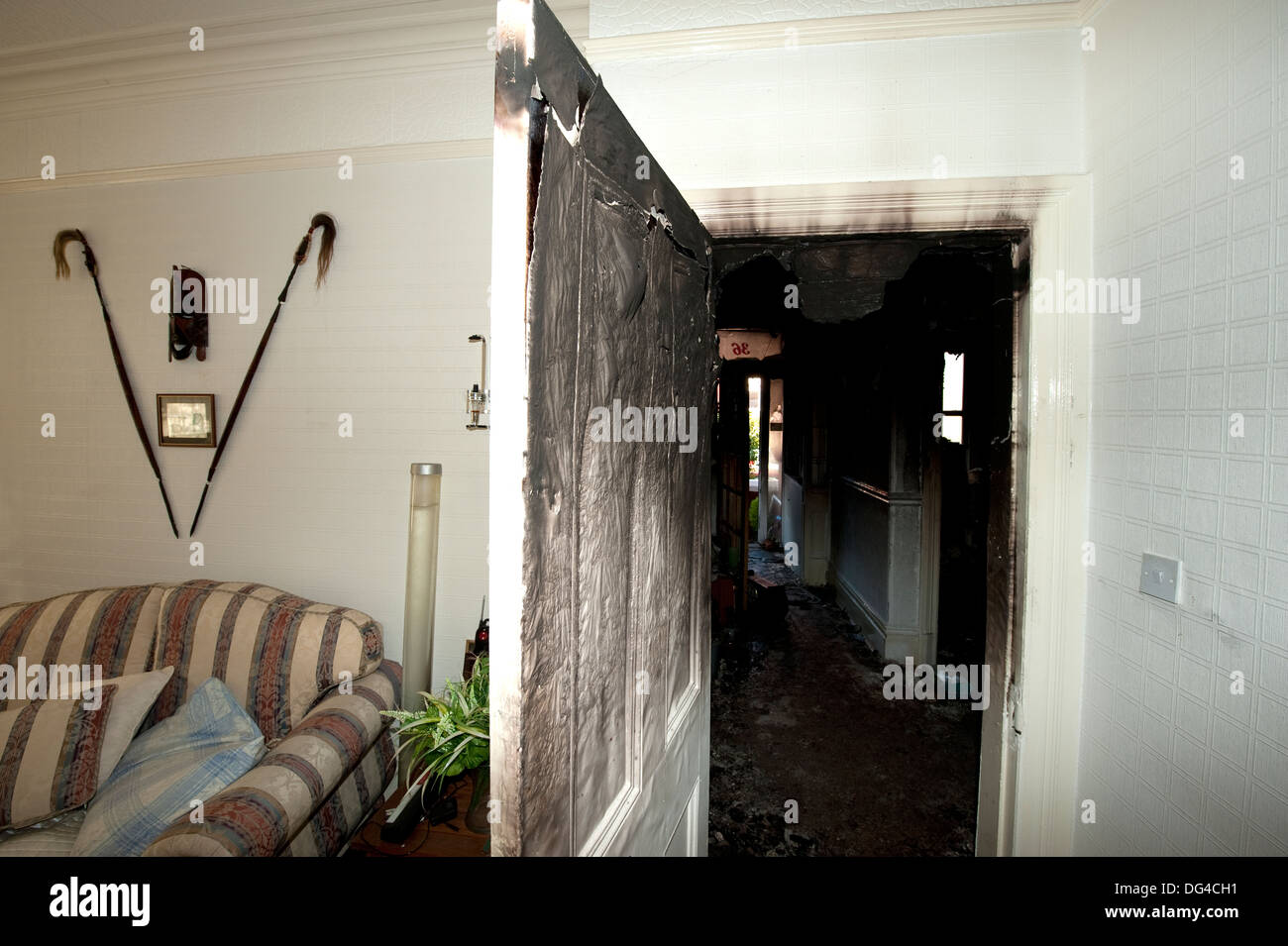 Closed door kept fire smoke back house stopped spread Stock Photo