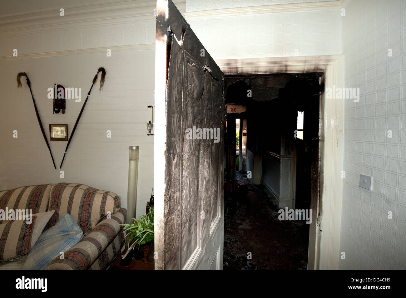 Closed door kept fire smoke back house stopped spread Stock Photo