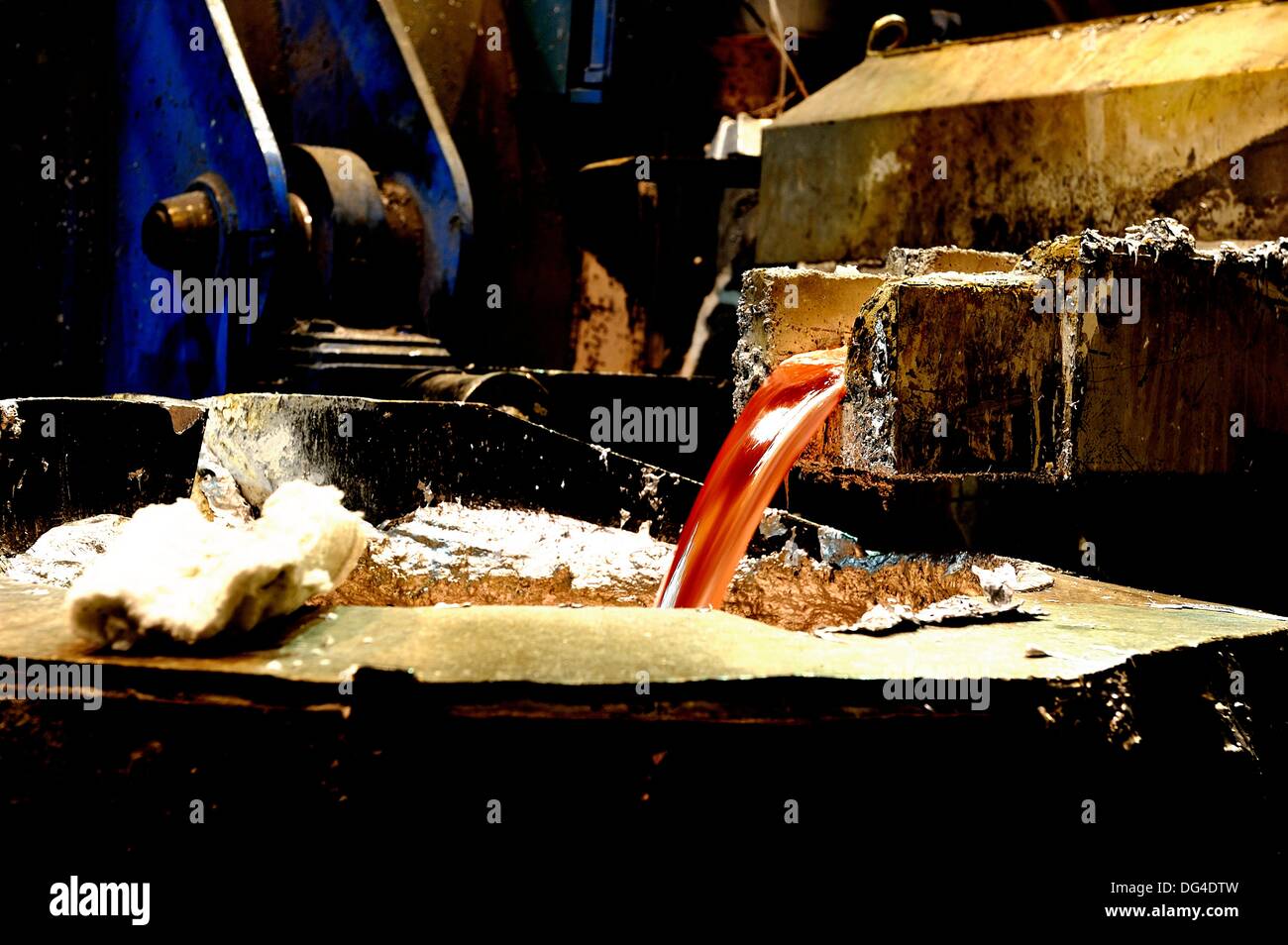 High-contrast image of the discharge of molten aluminum Stock Photo