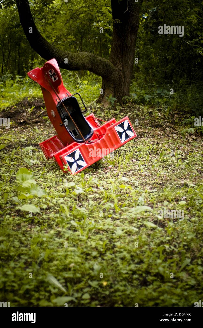 Toy replica airplane nose dives into green forest Stock Photo Alamy
