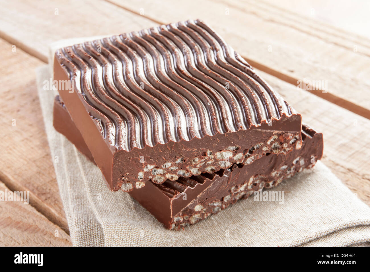 Chocolate with puffed rice on rustic fabric Stock Photo