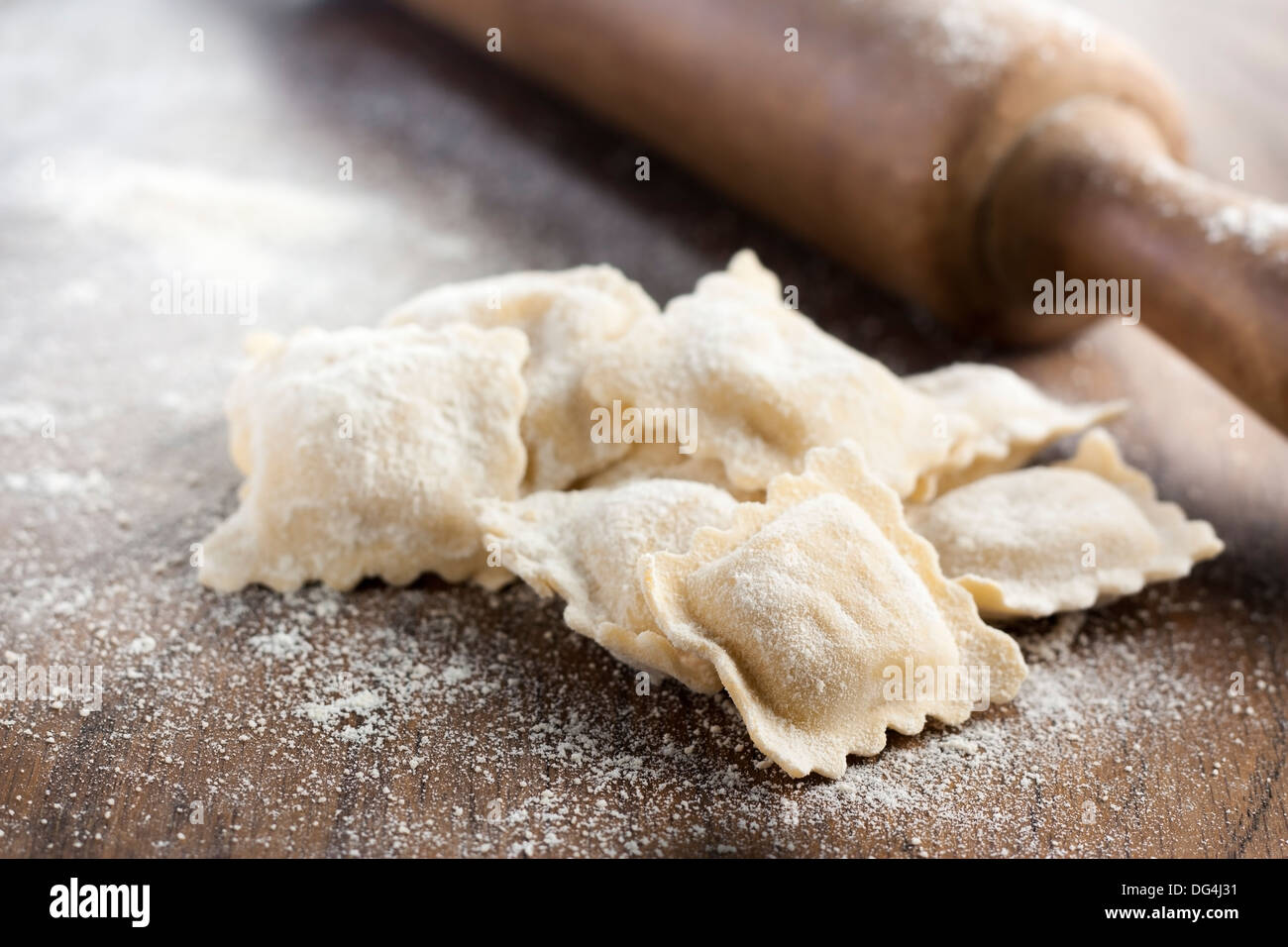 Preparing delicious homemade ravioli with a roller Stock Photo