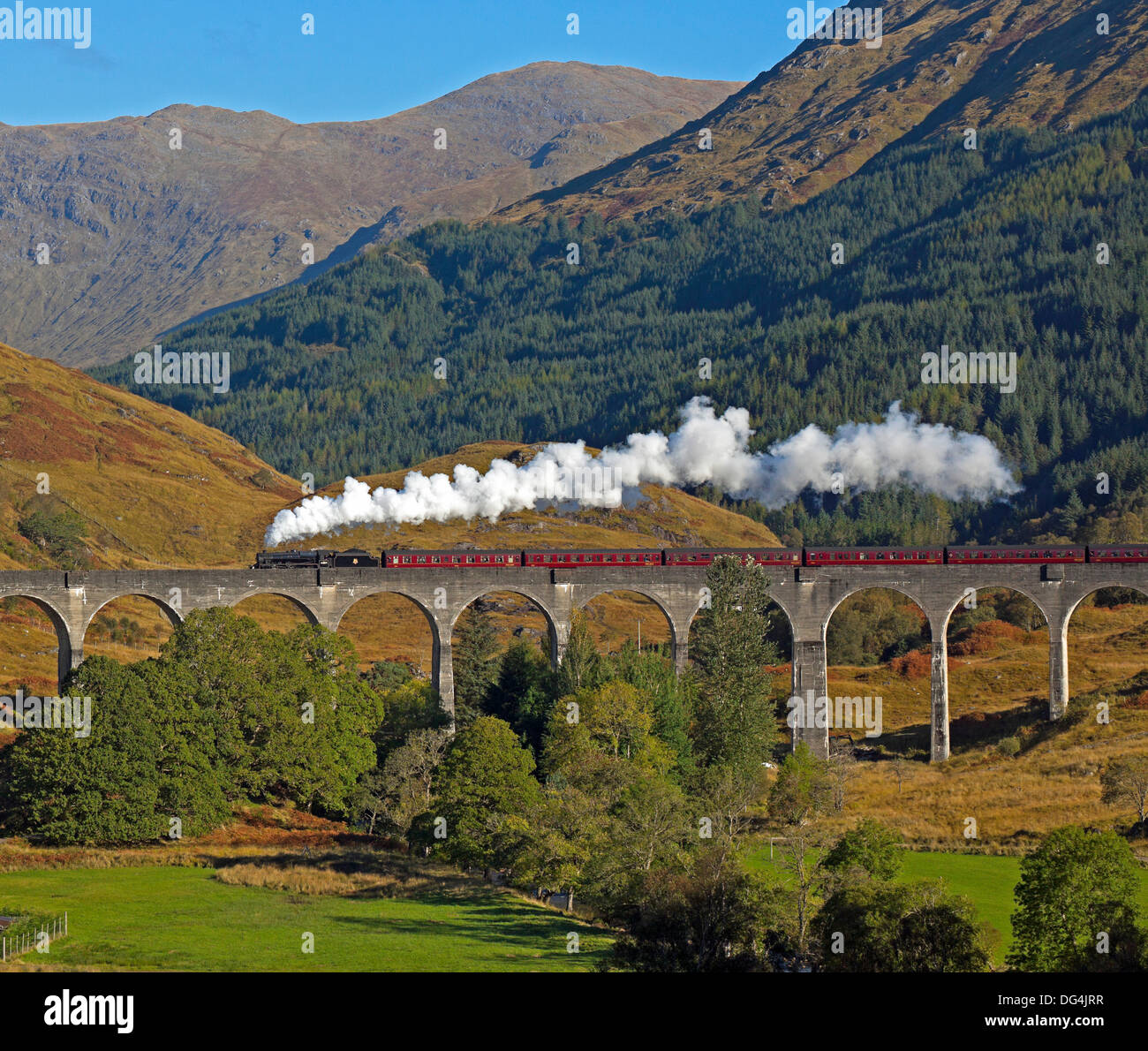 Jacobite Steam Train crossing Glenfinnan Viaduct Lochaber Scotland UK Stock Photo
