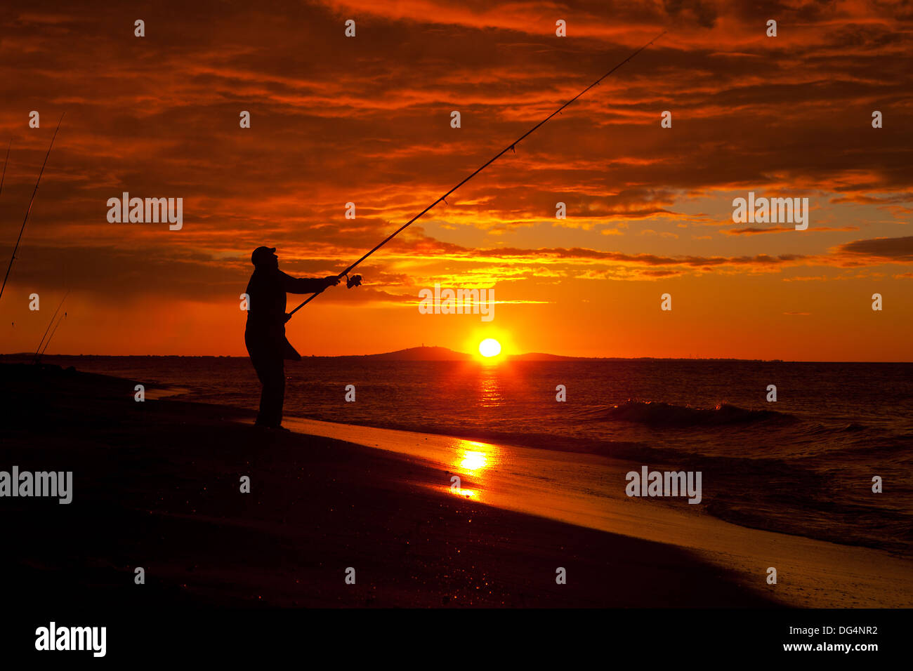 Silhouette Of Fisherman With Sunrise And Big Fish Net In The Background  Stock Photo, Picture and Royalty Free Image. Image 83804102.