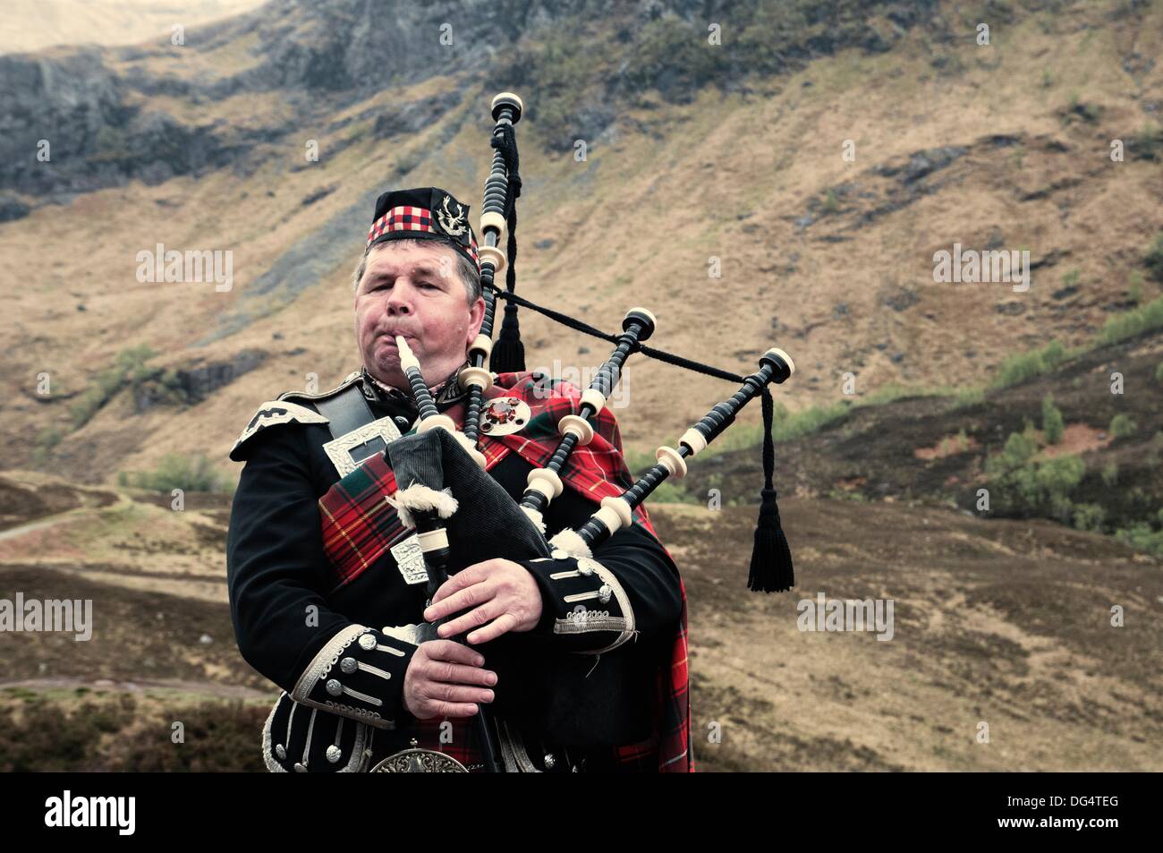 Scottish man playing the bagpipes Stock Photo Alamy