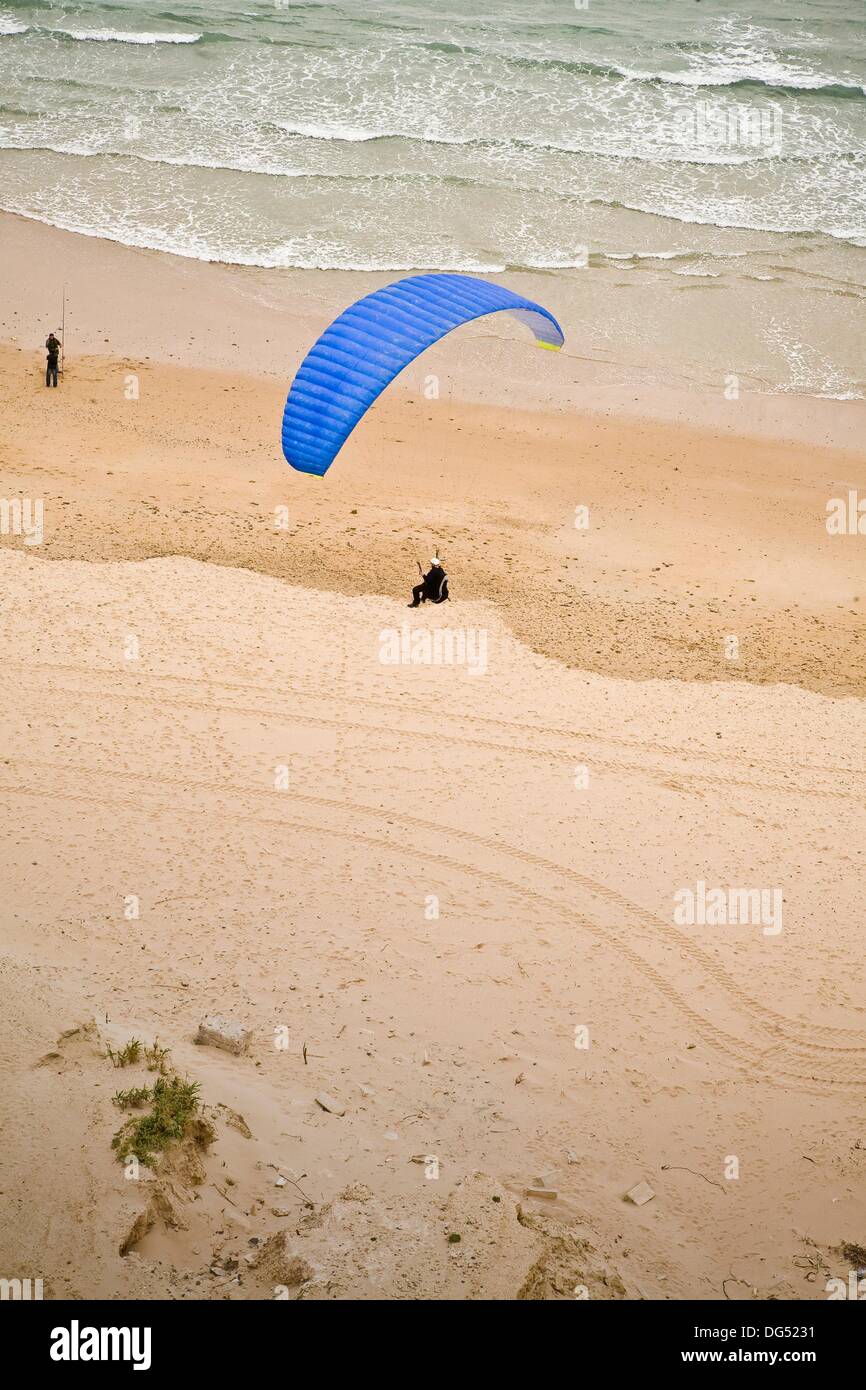 Paraglider landing on Conil de la Frontera´s beach  With east wind, one can fly hours right above that spot´s dunes Stock Photo