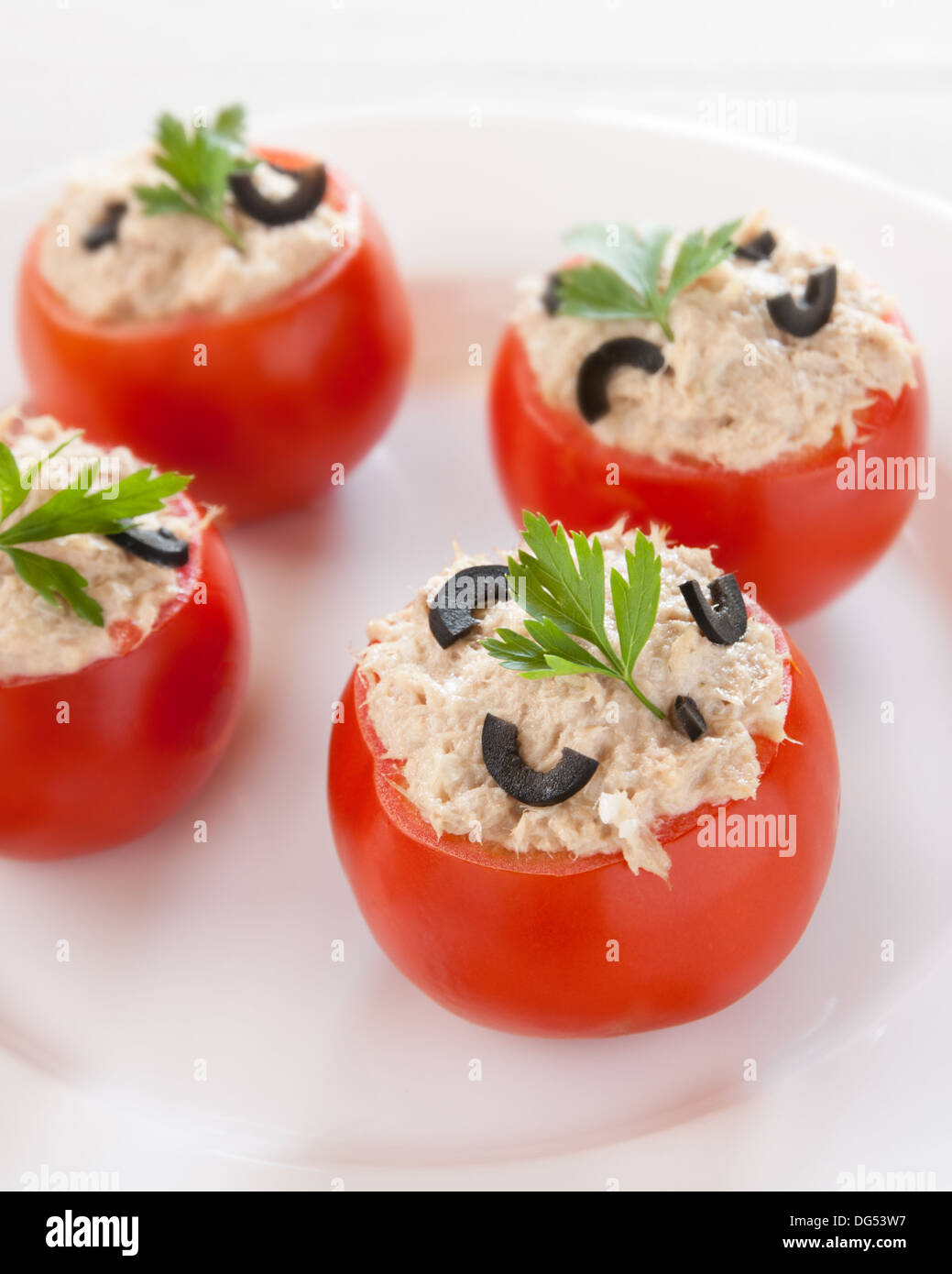 Stuffed tomatoes with tuna and black olives with parsley Stock Photo