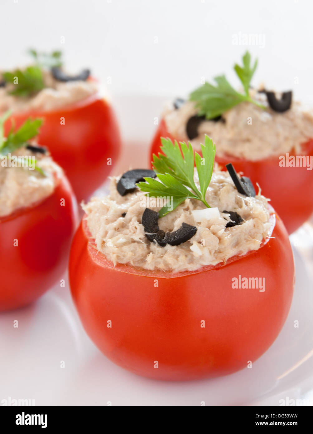 Stuffed tomatoes with tuna and black olives with parsley Stock Photo