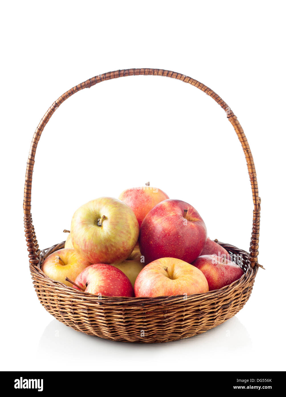 Wicker basket full of apples isolated on white Stock Photo - Alamy