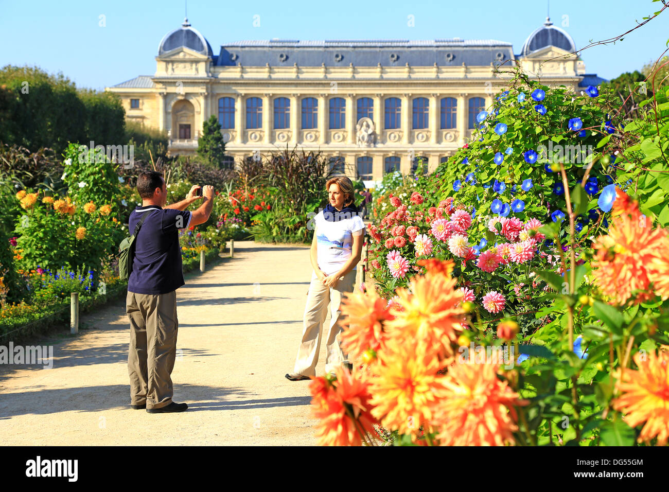 Tourists taking pictures of each other in the Jardin de Plantes garden - main botanical garden in France. Stock Photo
