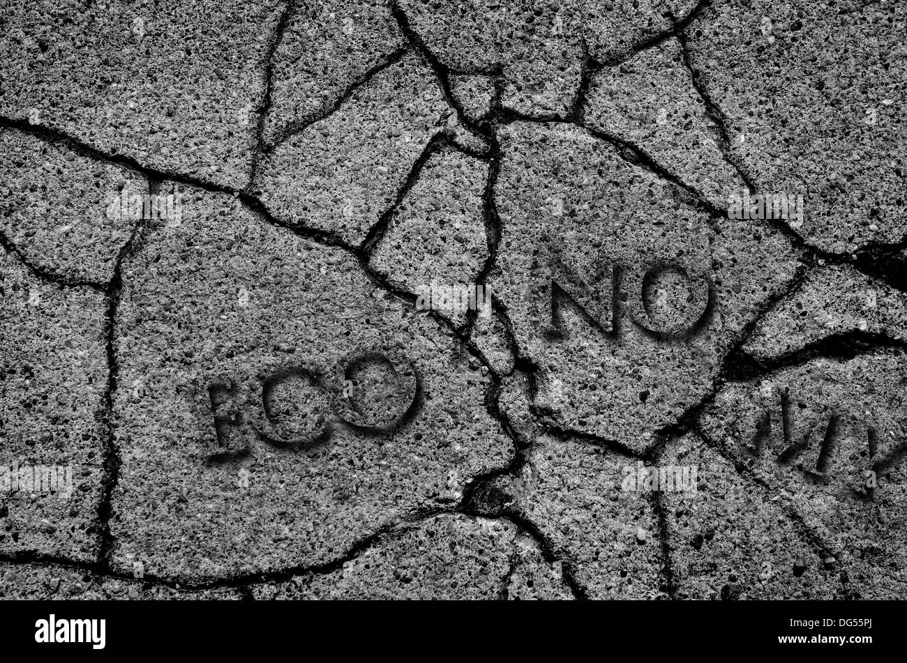 Crack in asphalt symbolizing a broken economy Stock Photo