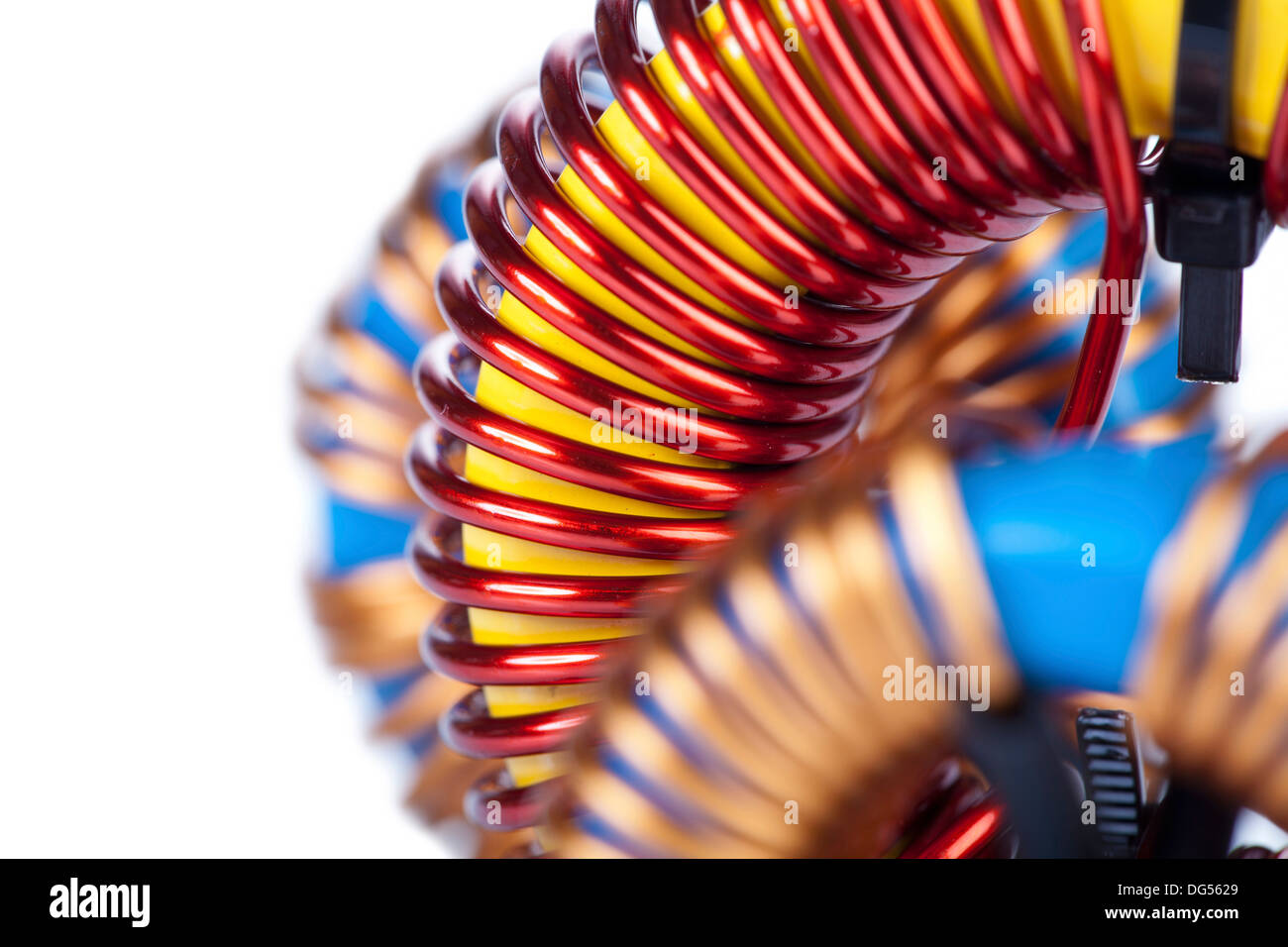 Detail Closeup View of three Industrial Toroidal Choke Coil isolated