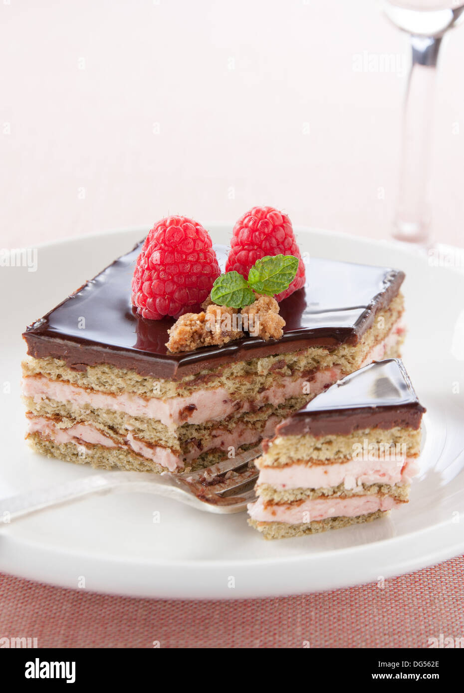 Portion of chocolate and strawberry cake on the table Stock Photo