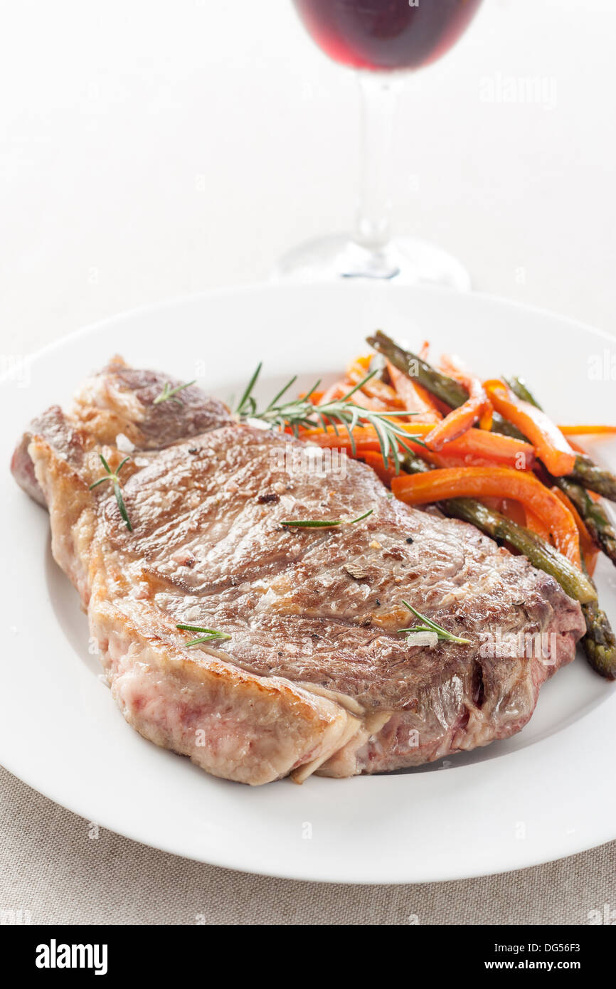 roasted beef steak with fried vegetables and wine Stock Photo - Alamy