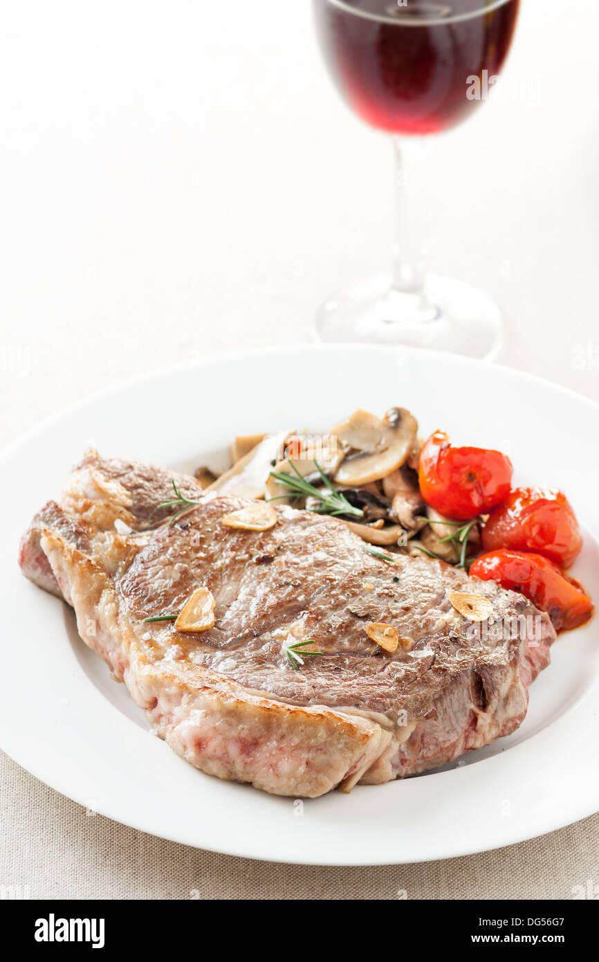 Roasted beef steak with fried vegetables and wine Stock Photo - Alamy