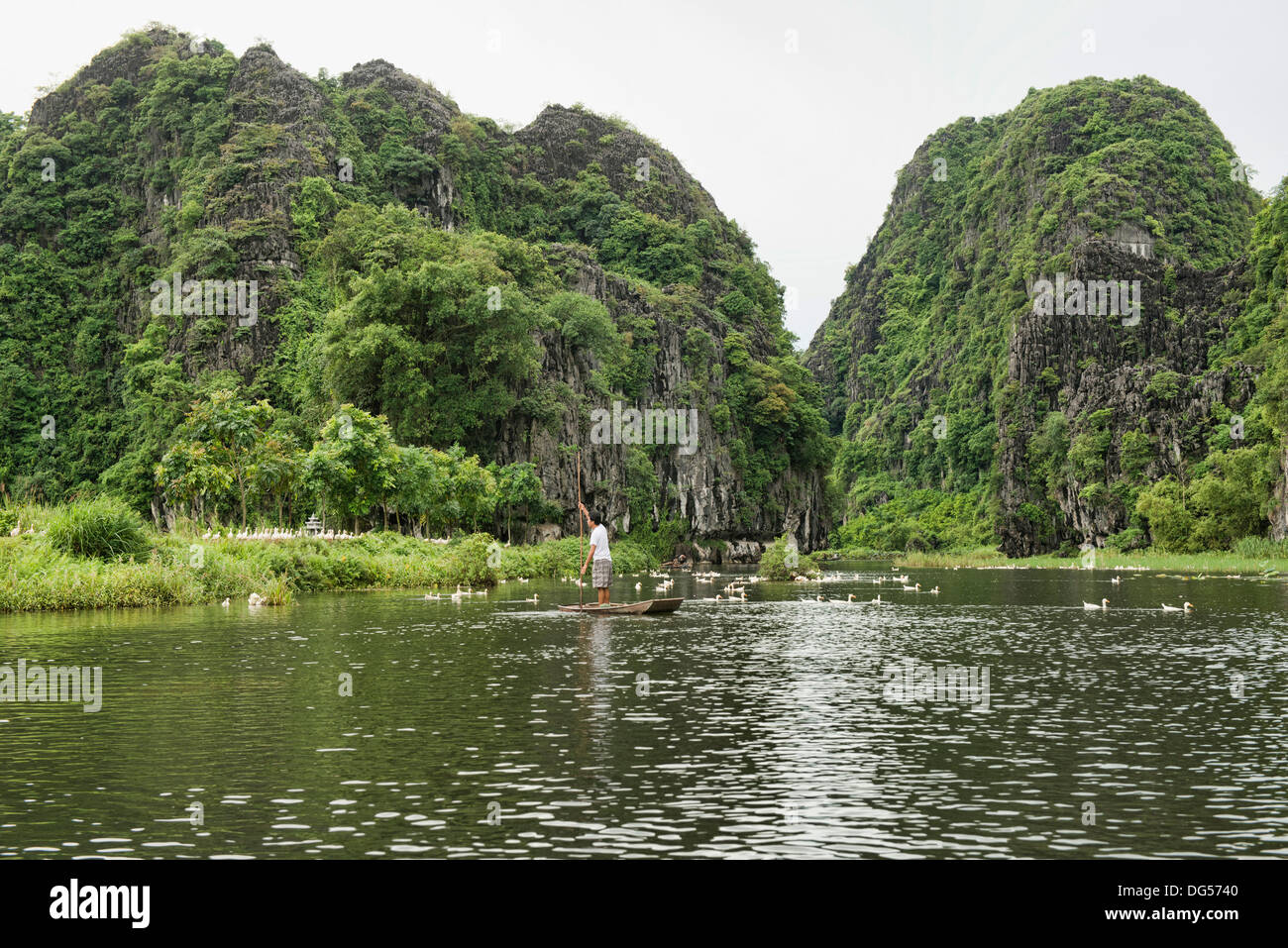 sightseeing on the Tam Coc River in Ninh Binh, Vietnam Stock Photo