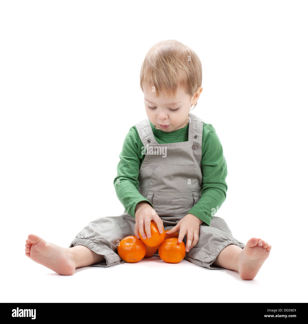 Baby with oranges. Isolated on white background Stock Photo Alamy