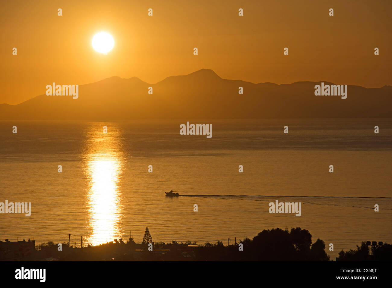 AEGEAN, GREECE. Sunrise over the Cycladic island of Anafi, as seen from Santorini (Thira). 2013. Stock Photo