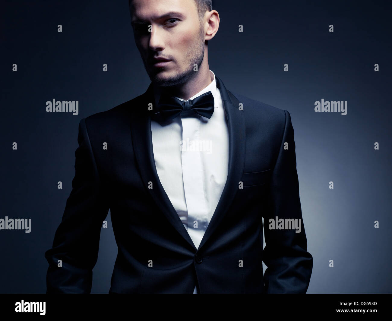 Portrait of handsome stylish man in elegant black suit Stock Photo - Alamy