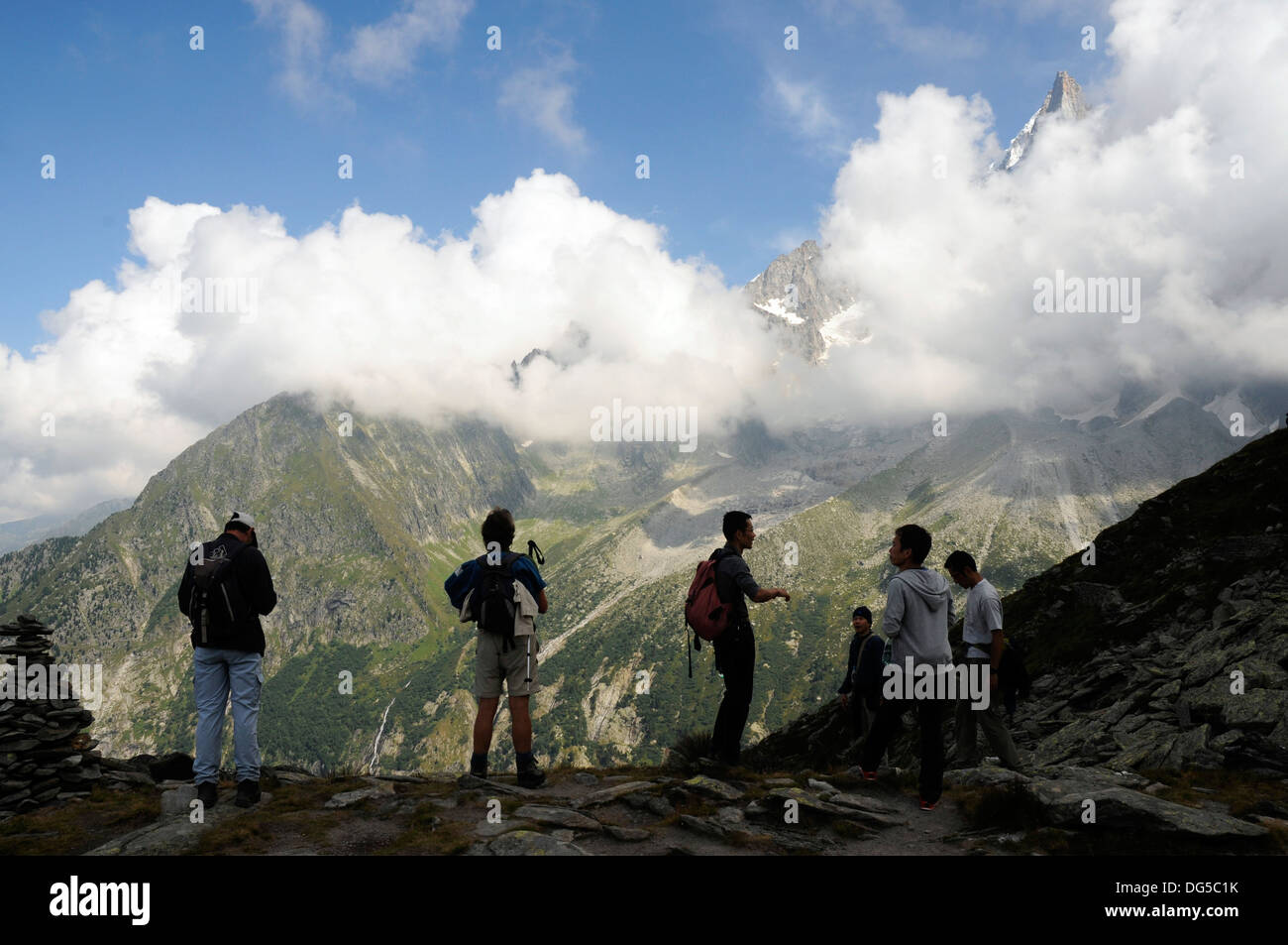 Hikers in silhouette at Signal Forbes above Montenvers, Chamonix, France Stock Photo