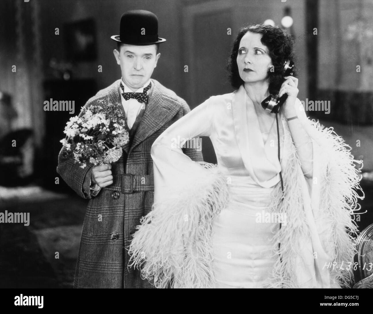 Stan Laurel and Mae Busch, on-set of the Film, 'Chickens Come Home', Metro-Goldwyn-Mayer, 1931 Stock Photo