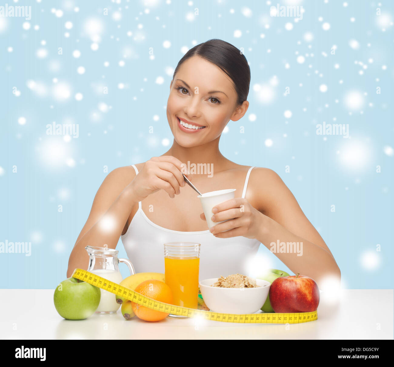 woman with healthy breakfast and measuring tape Stock Photo