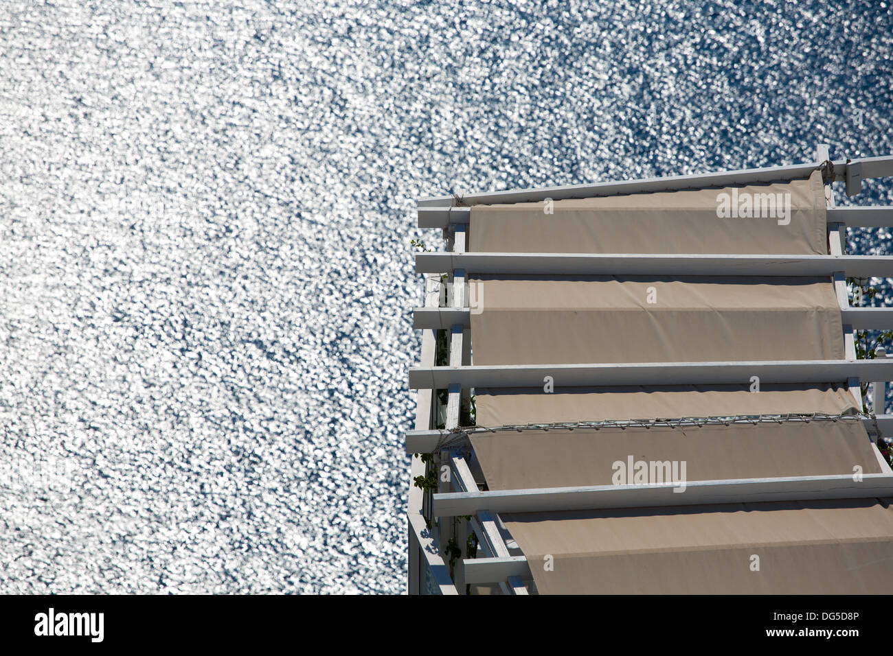 Roof of a balcony and the Mediterranean sea, Santorini in Greece Stock Photo