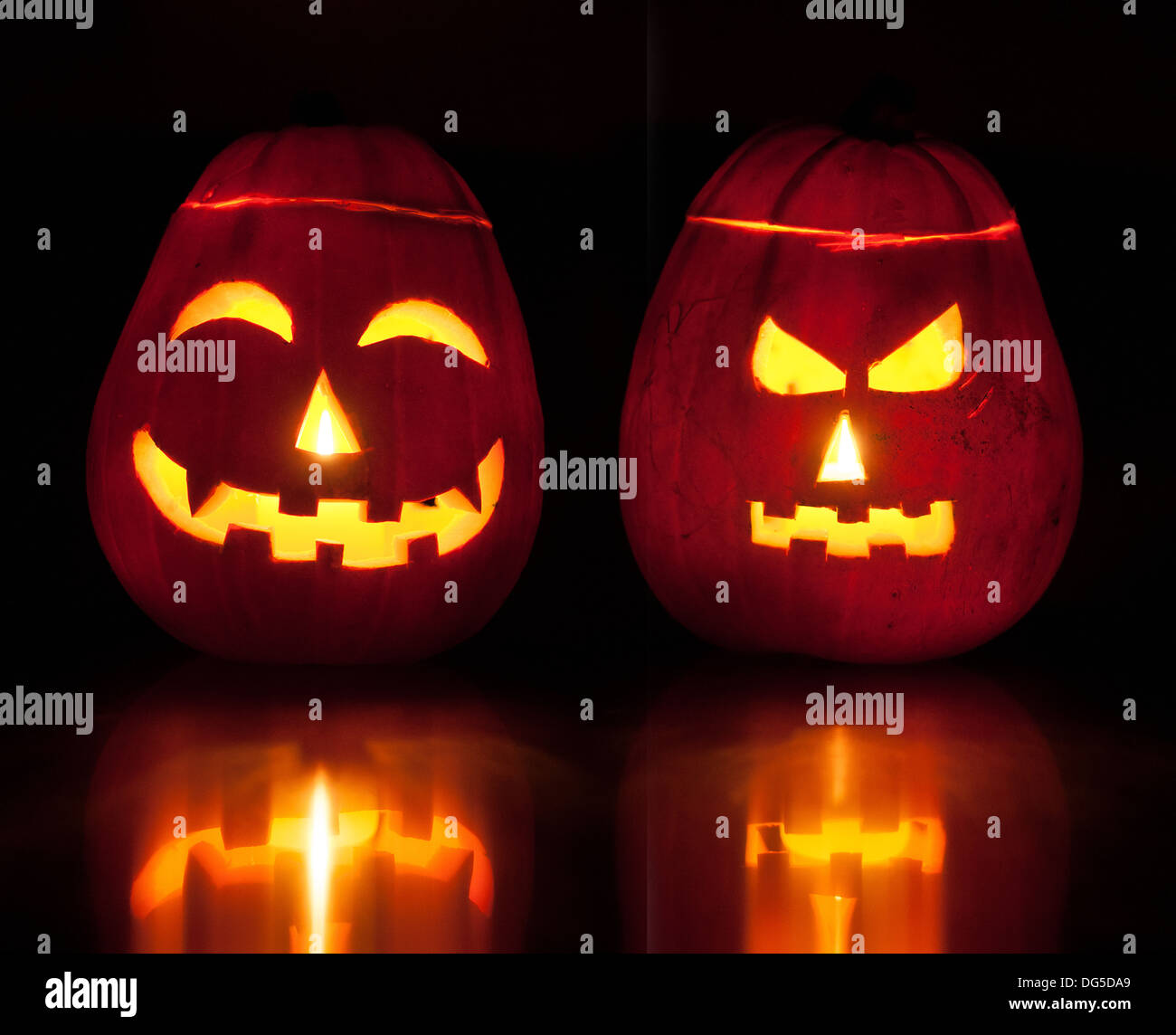 Two Halloween pumpkin lanterns lighting up the dark. Stock Photo