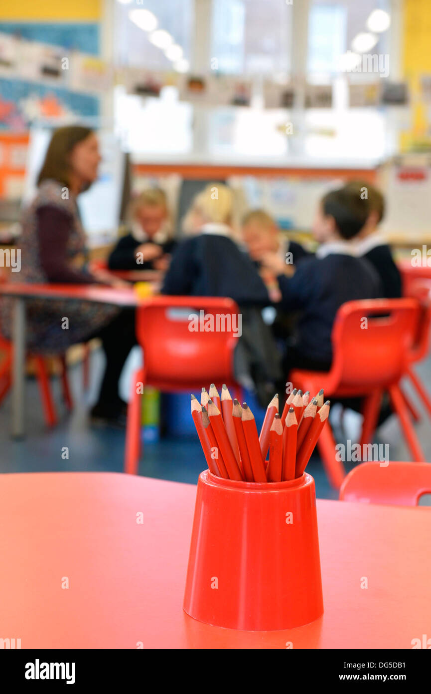 A pot of pencils in a school classroom for use by pupils and teachers in learning, Stock Photo