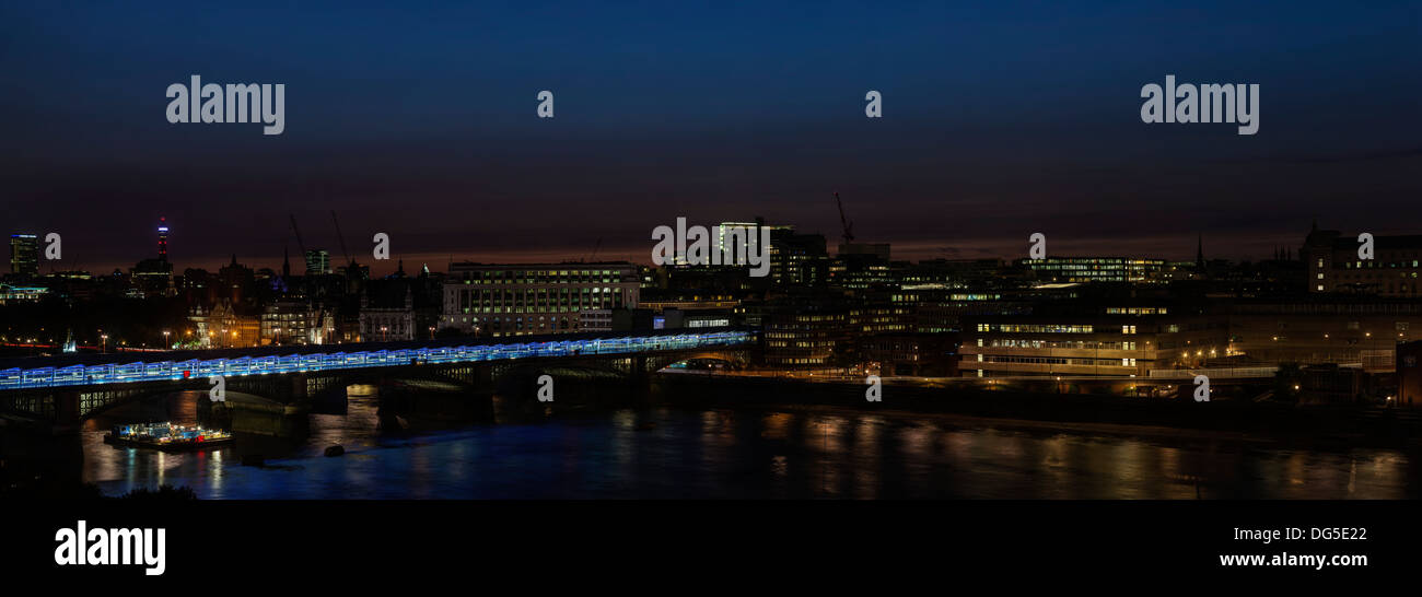 dusk or night shot of London looking north across the Thames Stock Photo